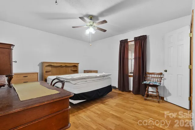 a bedroom with furniture and window