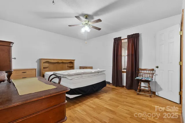 a bedroom with furniture and window