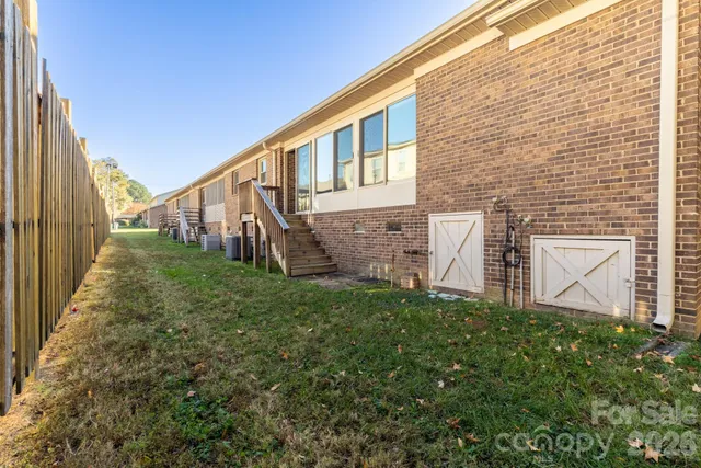 a backyard of a house with lots of green space