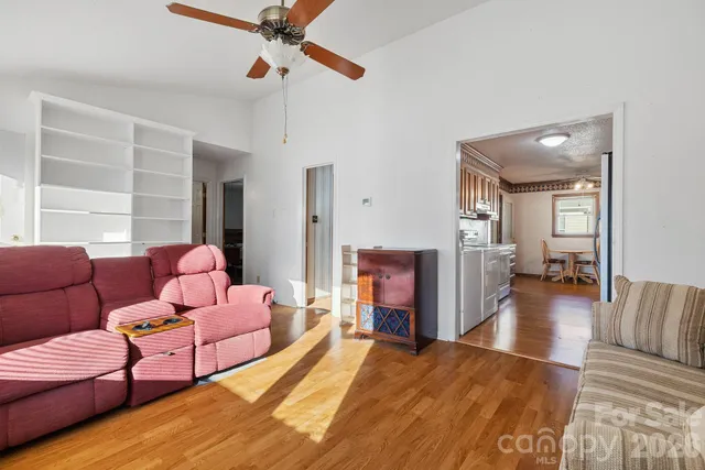 a bedroom with furniture and a wooden floor