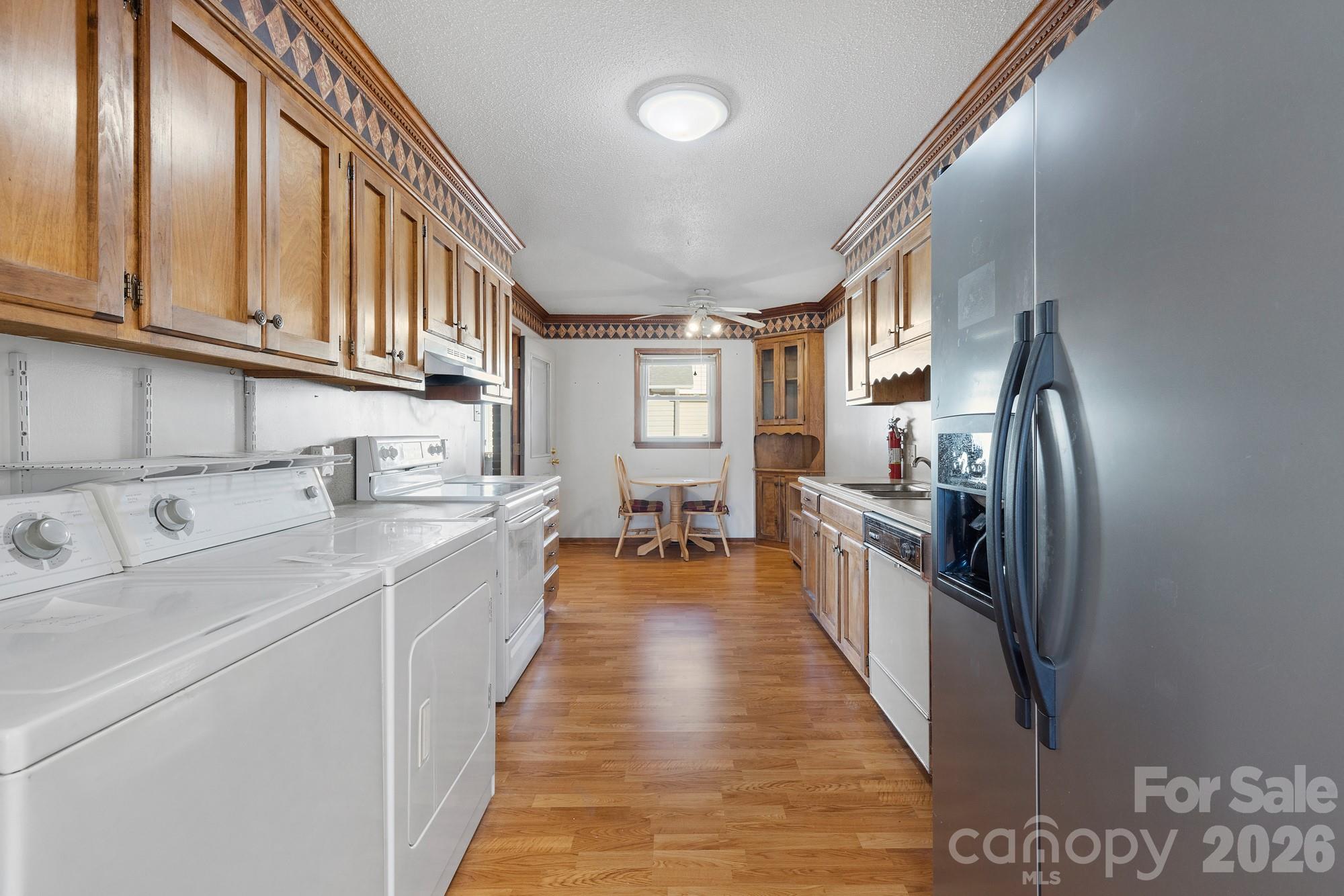 1951 Ebenezer Road Rock Hill, SC 29732 - Photo 8 of 19 a large kitchen with stainless steel appliances lots of counter space and wooden floor