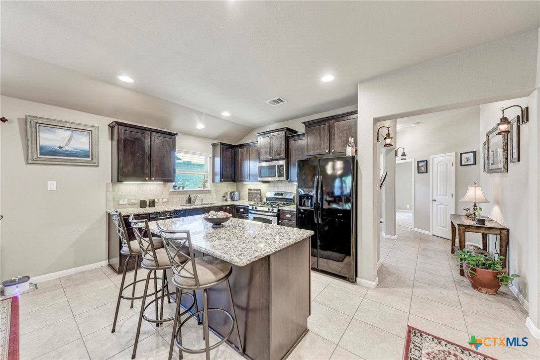 700 Cortona Cove Georgetown, TX 78628 - Photo 9 of 46 Kitchen featuring center island