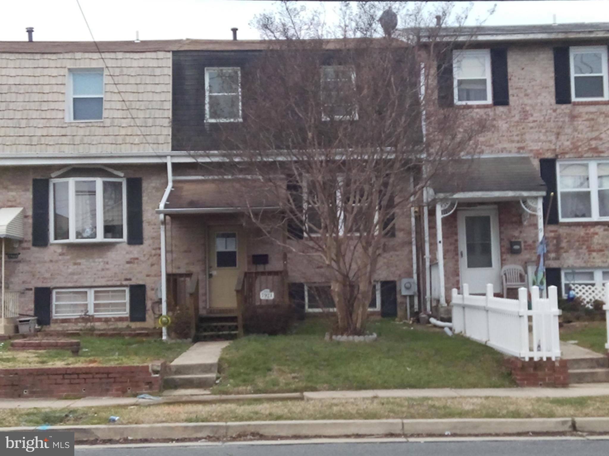 7921 Lynch Road Baltimore, MD 21222 - Photo 1 of 21 a front view of a house with garden