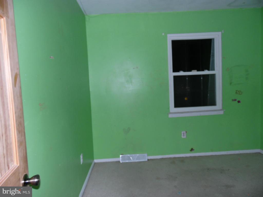 7921 Lynch Road Baltimore, MD 21222 - Photo 16 of 21 a view of an empty room and window