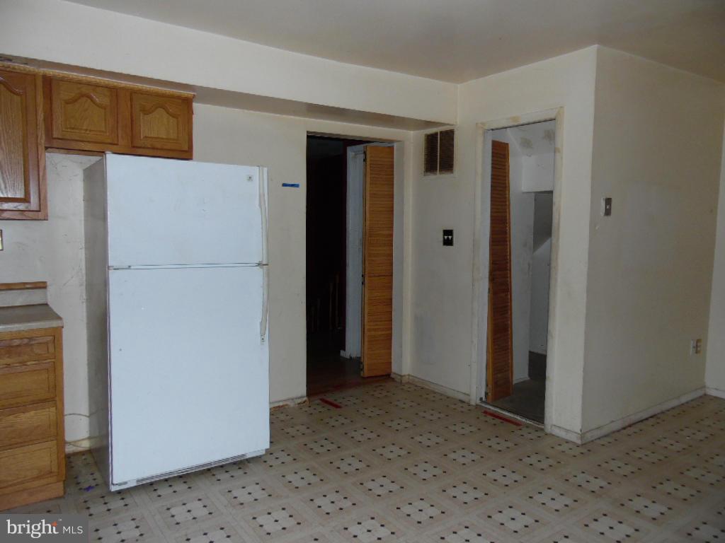 7921 Lynch Road Baltimore, MD 21222 - Photo 6 of 21 a view of a hallway with closet and door