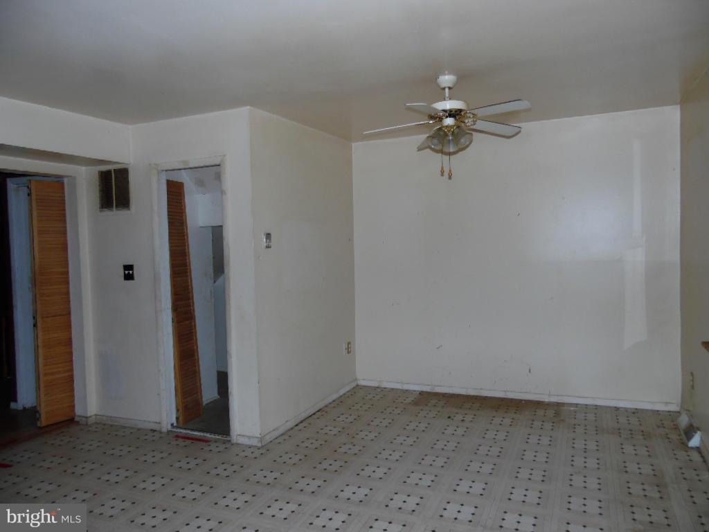 7921 Lynch Road Baltimore, MD 21222 - Photo 7 of 21 wooden floor in an empty room