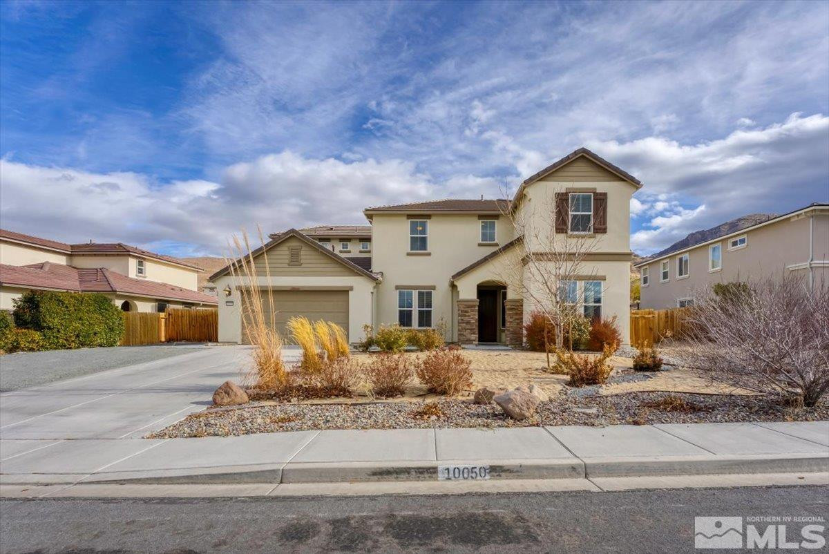 10050 Barrel Racer Drive Reno, NV 89521 - Photo 2 of 30 a front view of a house with a yard