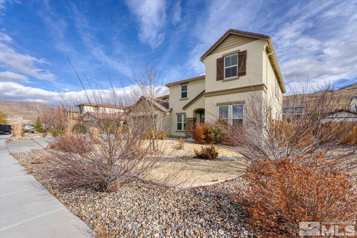 10050 Barrel Racer Drive Reno, NV 89521 - Photo 3 of 30 a view of a house with a yard