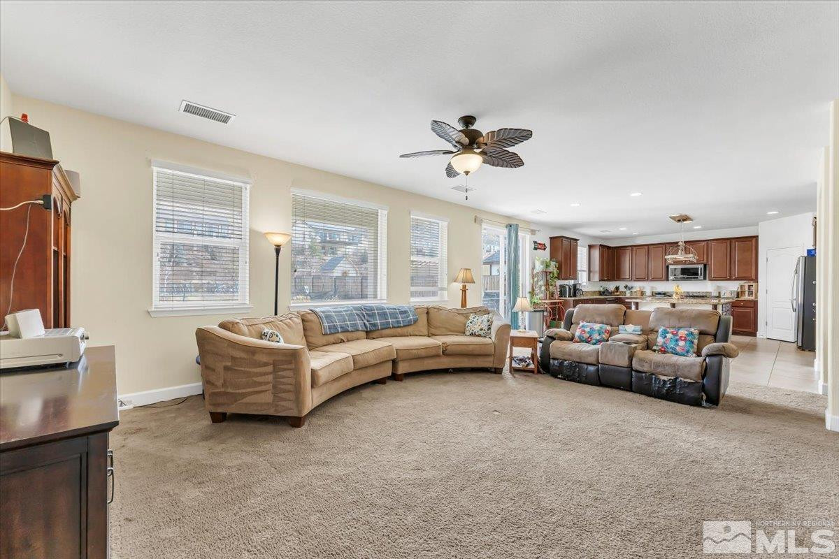 10050 Barrel Racer Drive Reno, NV 89521 - Photo 10 of 30 a living room with furniture and a large window