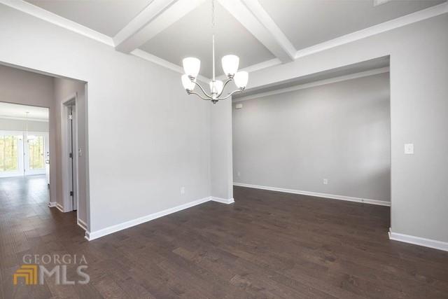 1916 Endress Circle Hampton, GA 30228 - Photo 3 of 17 an empty room with fan and wooden floor
