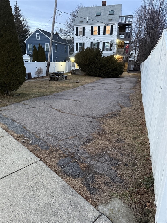 1208 Morton Street, Unit 3 Boston, MA 02126 - Photo 17 of 17 a front view of a house with a yard