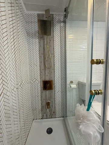 a bathroom with a sink and a shower