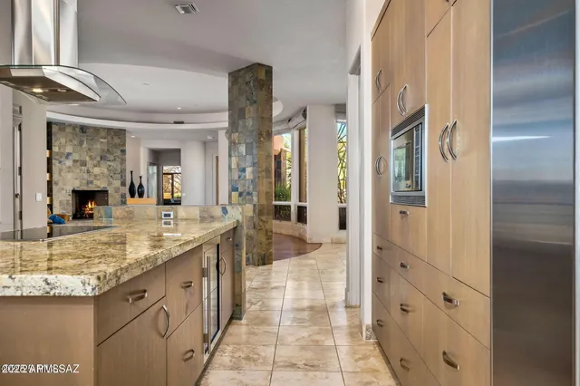 a bathroom with a granite countertop sink mirror and shower