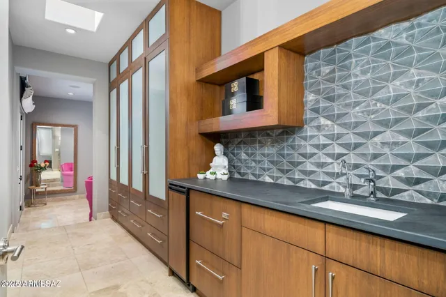 a view of a brick wall with an outdoor space