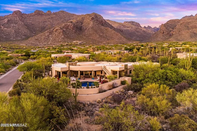 a view of a city with mountains in the background