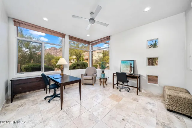 a workspace with furniture window and outside view
