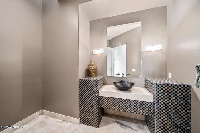 a bathroom with a sink and a mirror