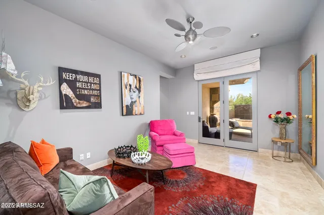 a living room with furniture potted plant and a chandelier
