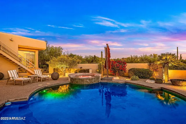 a view of a lake with a table and chairs
