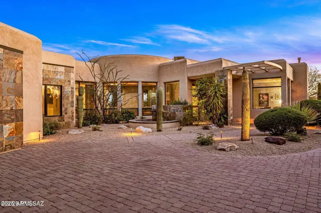 a view of a house with backyard porch and sitting area