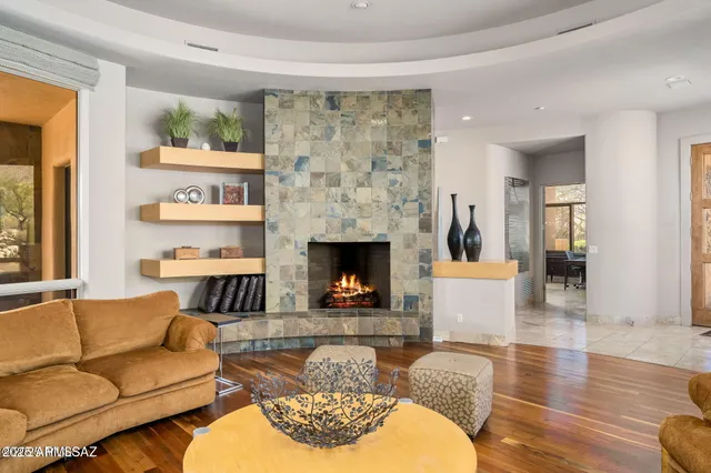 a living room with furniture and a fireplace
