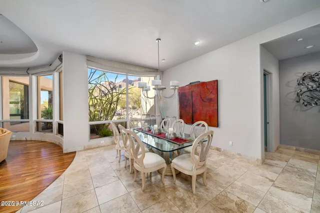 a dining room with furniture window and outside view