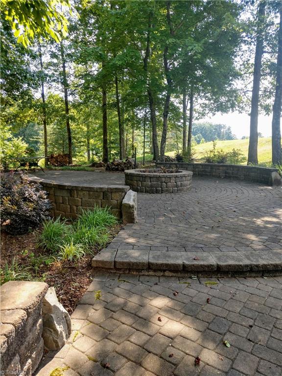 7933 Tranquility Place Oak Ridge, NC 27310 - Photo 3 of 4 Neighborhood firepit for entertaining at Village Woods