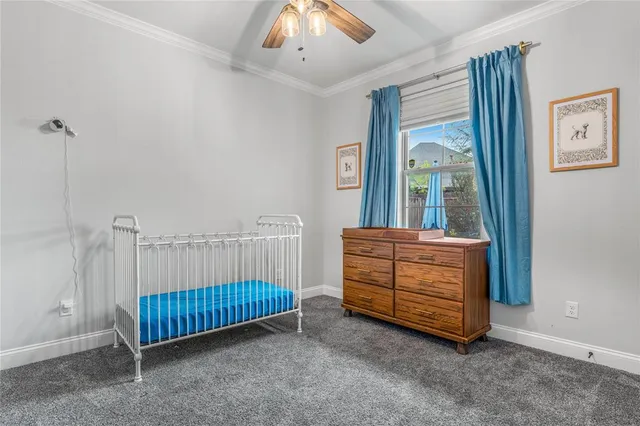 a room with stairs and a chandelier
