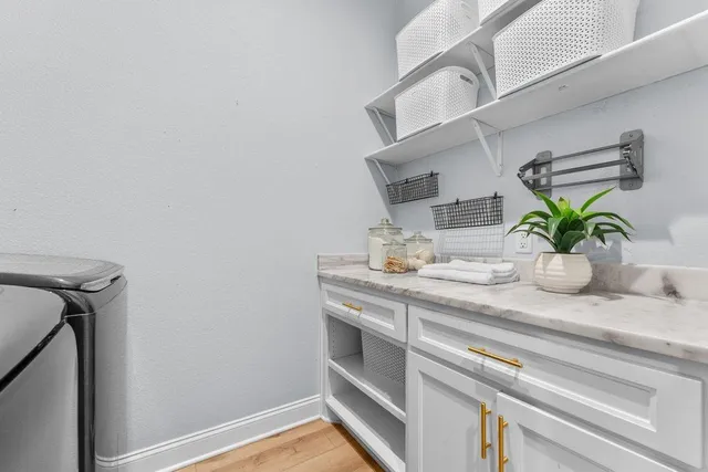 a sink with a potted plant on it