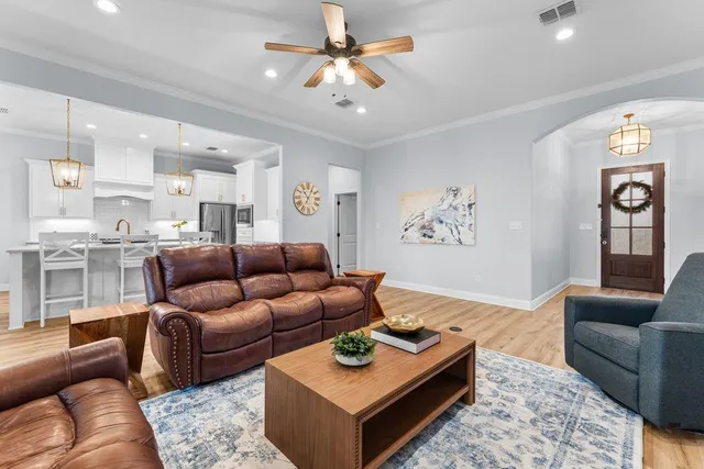 a living room with furniture and a rug