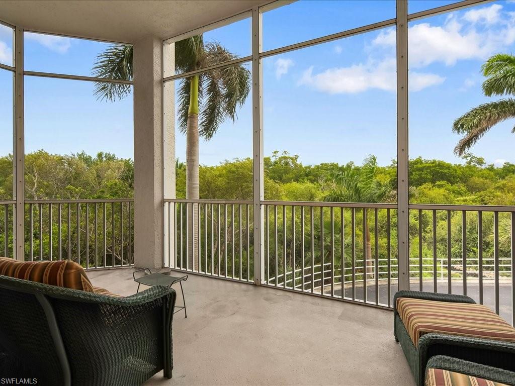 5550 Heron Point Drive, Unit 105 Naples, FL 34108 - Photo 17 of 20 a view of a balcony with lake view and a balcony