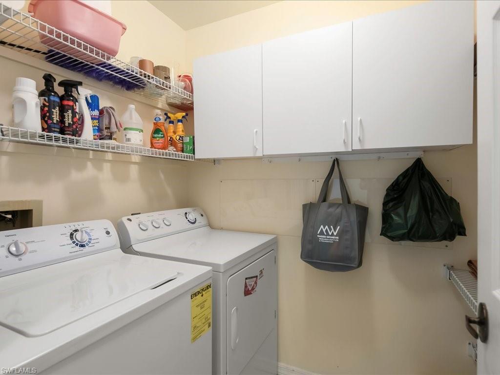 5550 Heron Point Drive, Unit 105 Naples, FL 34108 - Photo 18 of 20 a utility room with dryer and washer