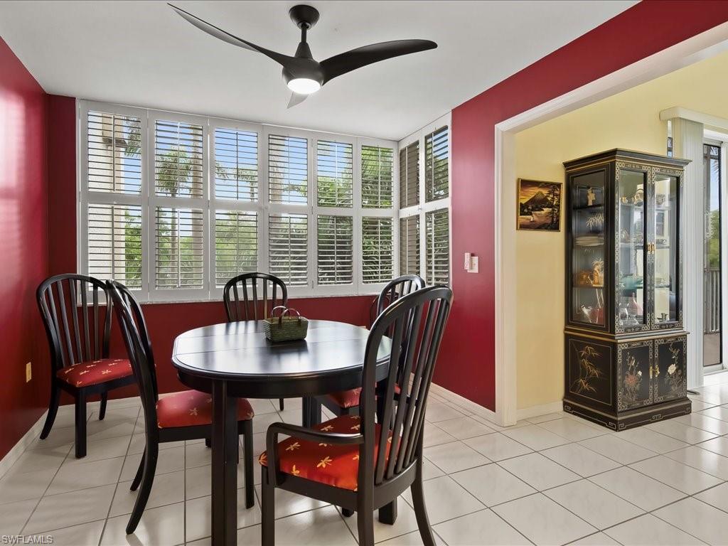 5550 Heron Point Drive, Unit 105 Naples, FL 34108 - Photo 5 of 20 a view of a a dining room with furniture window and outside view