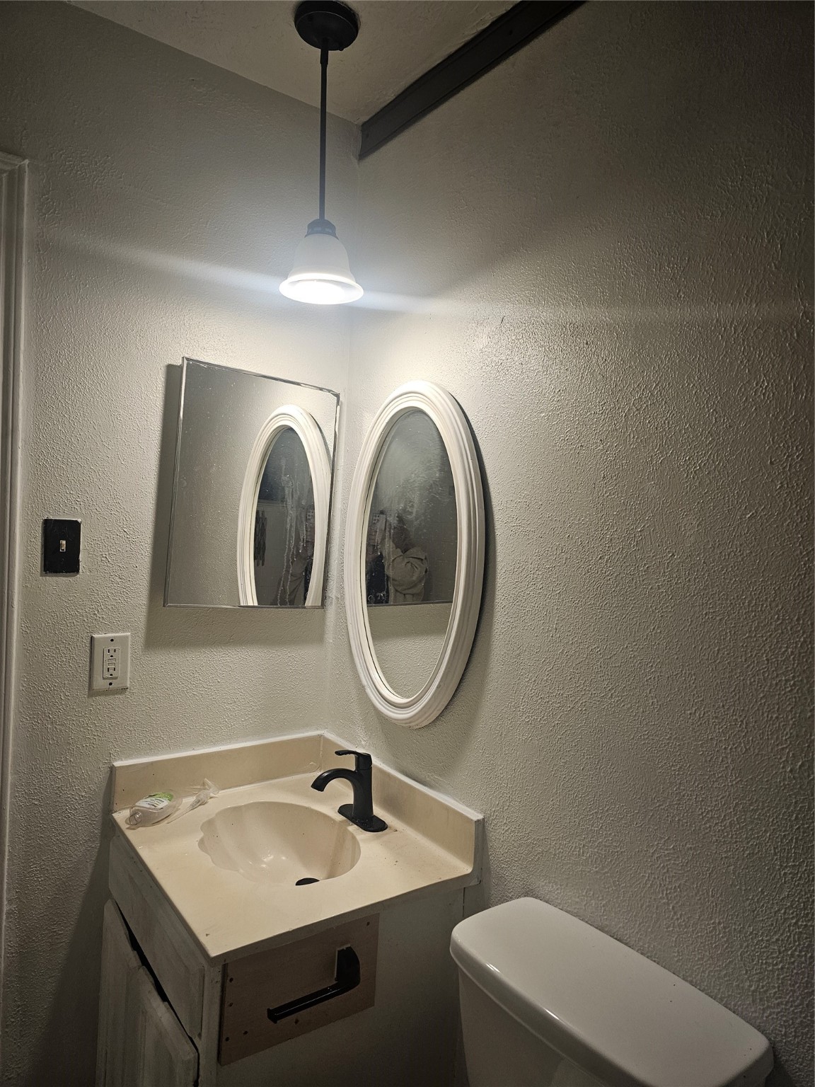 4011 Alshire Drive Spring, TX 77373 - Photo 24 of 34 a bathroom with a toilet sink and mirror