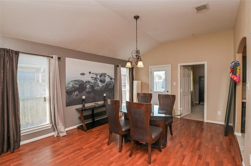 18446 South Wimbledon Drive Katy, TX 77449 - Photo 9 of 24 a view of a dining room with furniture window and wooden floor