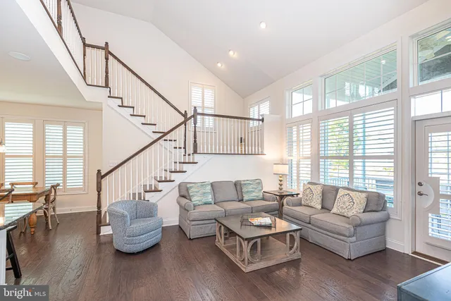 a bathroom with a double vanity sink toilet and a mirror