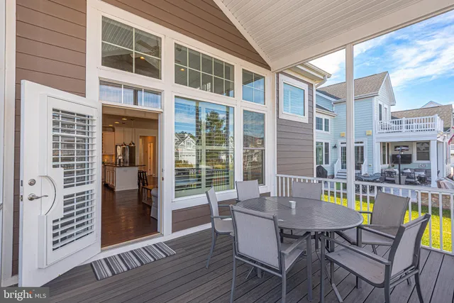 a bedroom with a large bed and a chandelier fan