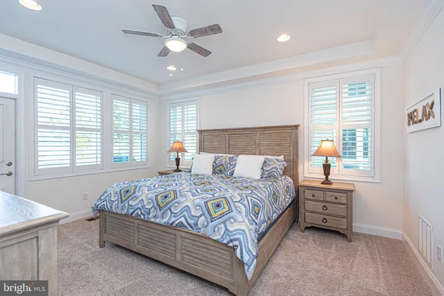 a en suite bathroom with a double vanity sink and a mirror
