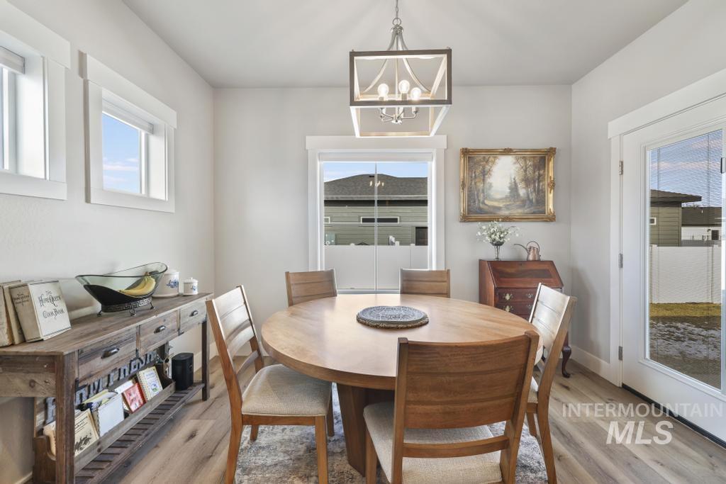 1020 13th Street Rupert, ID 83350 - Photo 15 of 30 Dining area with light wood finished floors, plenty of natural light, and suspended lighting