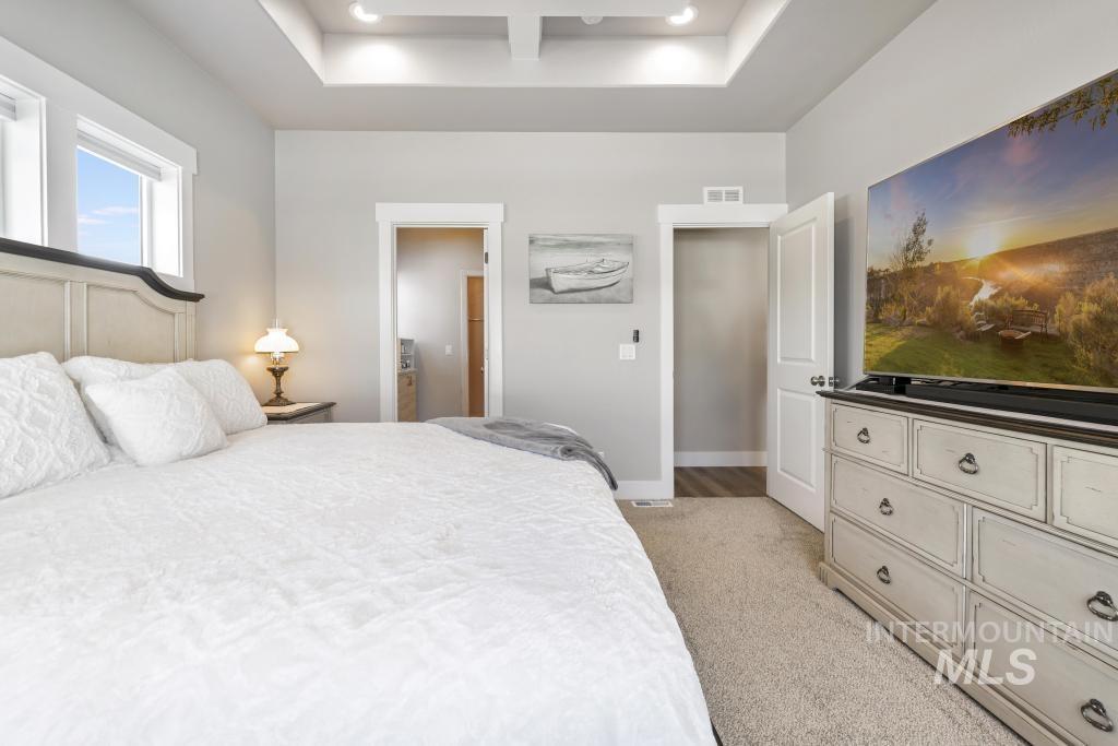 1020 13th Street Rupert, ID 83350 - Photo 18 of 30 Bedroom featuring light carpet, coffered ceiling, and recessed lighting