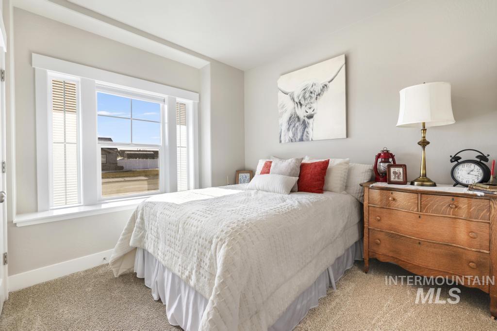 1020 13th Street Rupert, ID 83350 - Photo 21 of 30 Bedroom featuring light colored carpet and baseboards