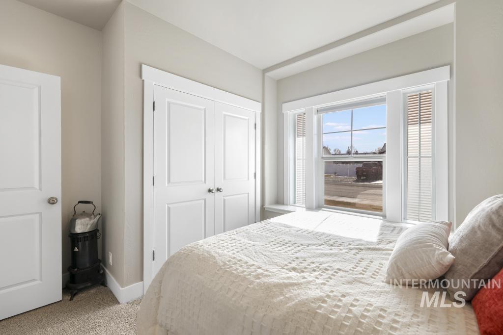 1020 13th Street Rupert, ID 83350 - Photo 22 of 30 Bedroom with light carpet and a closet