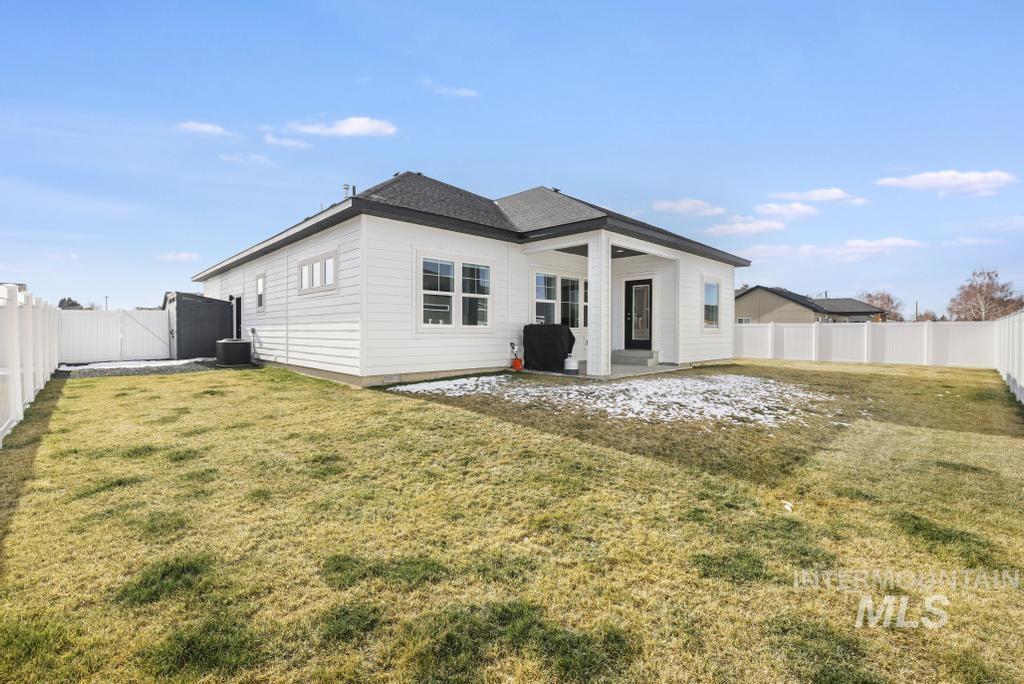 1020 13th Street Rupert, ID 83350 - Photo 28 of 30 Rear view of property with a fenced backyard, a patio area, and a gate