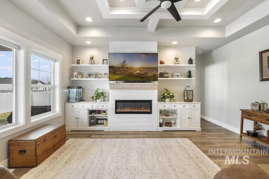 1020 13th Street Rupert, ID 83350 - Photo 9 of 30 Living room with wood finished floors, a glass covered fireplace, ceiling fan, and recessed lighting