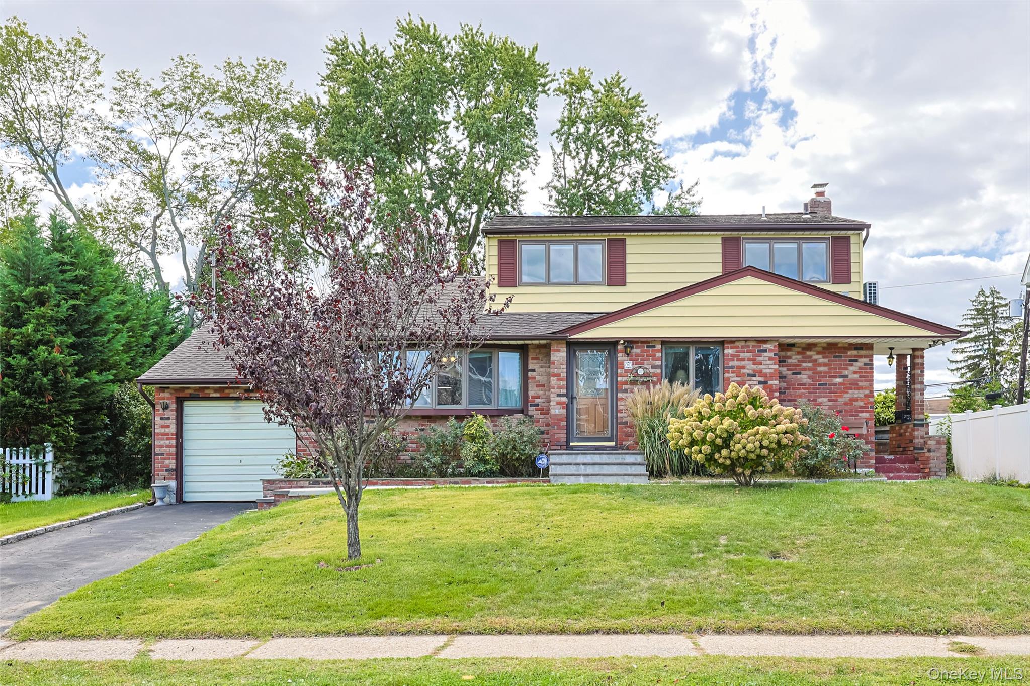 15 Alexander Drive Syosset, NY 11791 - Photo 1 of 1 a front view of a house with garden