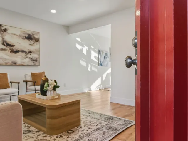 a kitchen with granite countertop a refrigerator and a sink