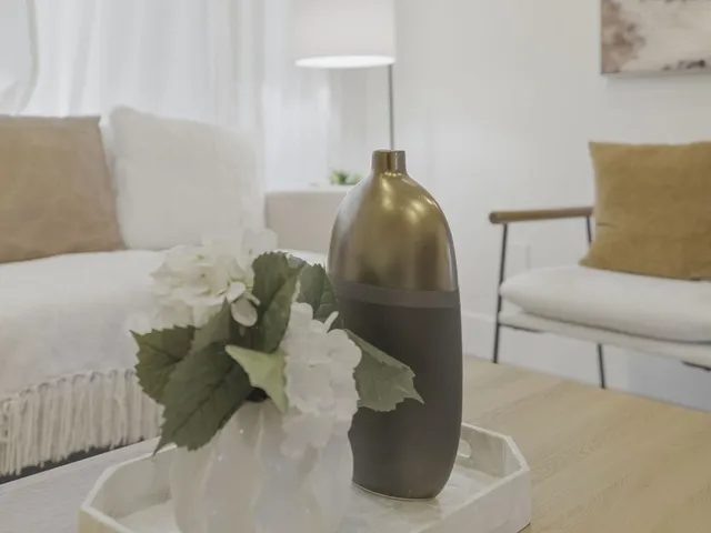 a bedroom with a large bed and a couch