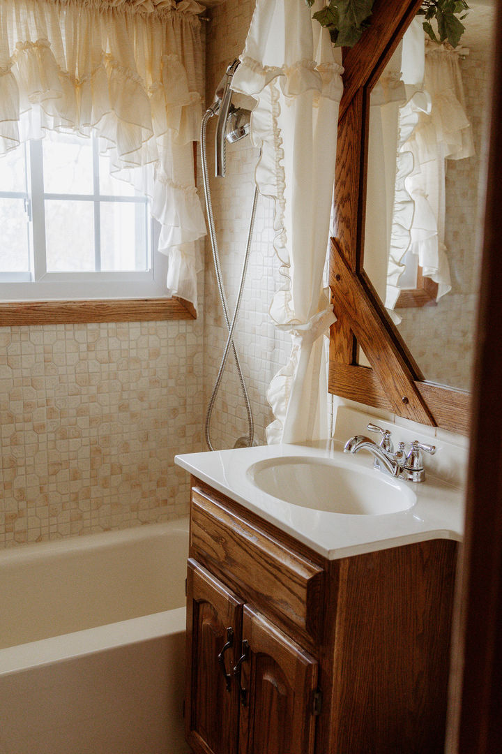 107 Arcadia Avenue Romeoville, IL 60446 - Photo 33 of 51 a bathroom with a sink and a mirror