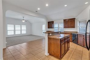 13117 Larks View Point Fort Worth, TX 76244 - Photo 26 of 26 a kitchen that has a sink a stove and a oven