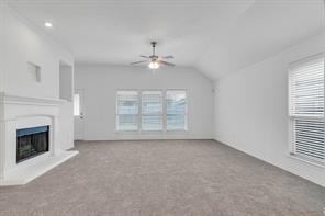 13117 Larks View Point Fort Worth, TX 76244 - Photo 14 of 26 an empty room with windows and fireplace